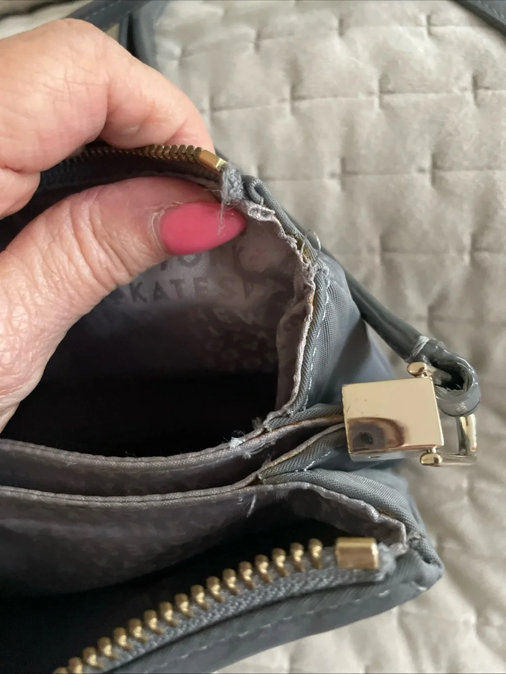 kate spade gray nylon crossbody with gold logo plaque